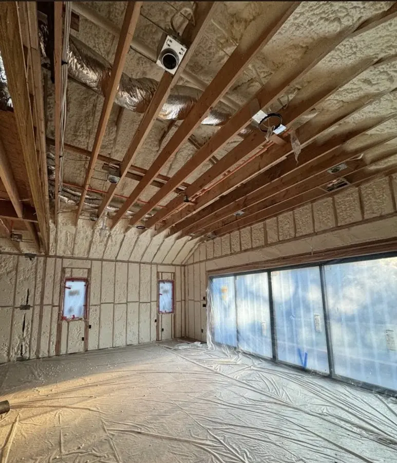 Interior walls and ceiling insulated with spray foam during new construction in Berryville